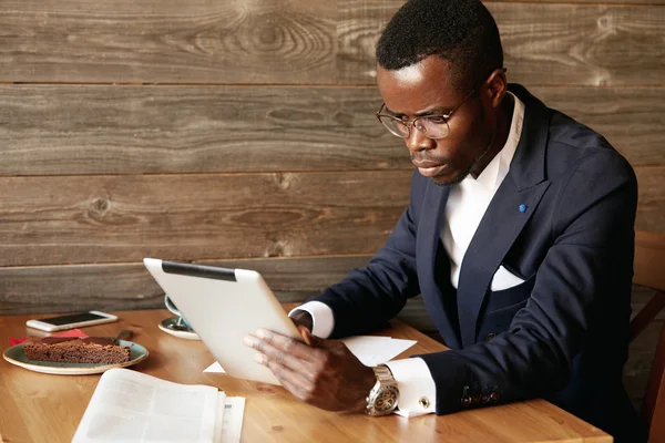 African American businessman holding tablet