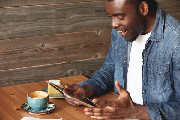 African American man sitting in a cafe