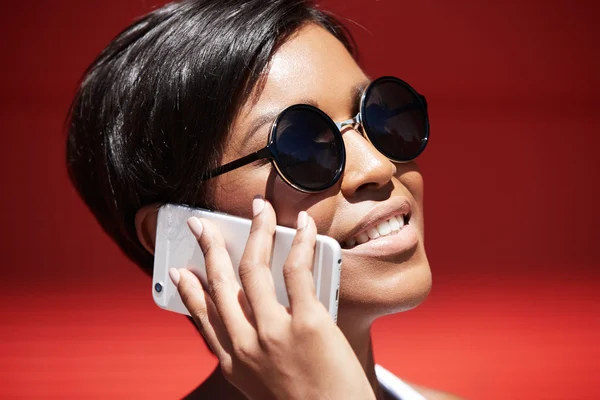 Woman sunglasses having phone