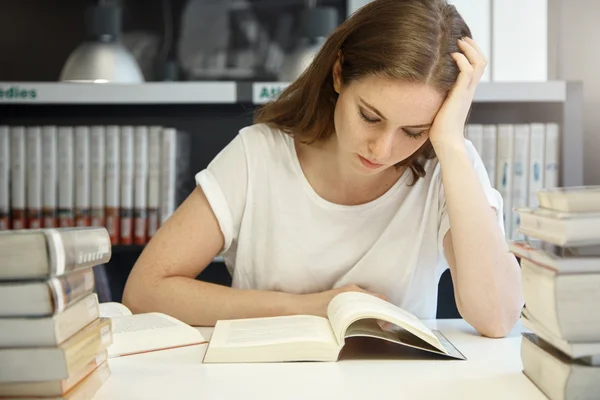 Girl reading textbook