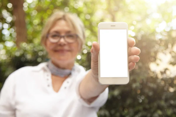 Elderly woman holding smart phone