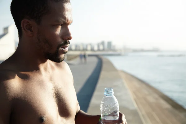 African American man with bottle of water