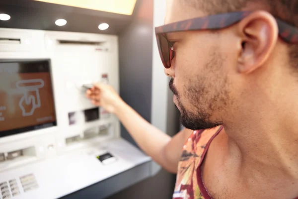 Man tourist using ATM machine