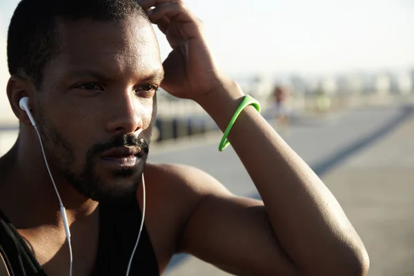 African runner listening to audio book