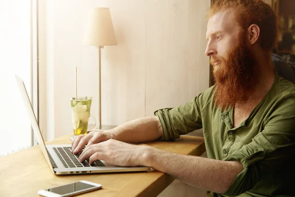 Hipster with long red beard