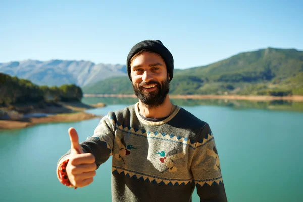 Summer fun man showing thumbs up smiling happy bearded model. Po