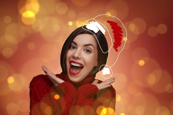 Christmas woman. Beauty model in santa hat and red sweater standing isolated. Funny laughing surprised woman portrait with open mouth. True Emotions. Red lips. Beautiful holiday makeup.