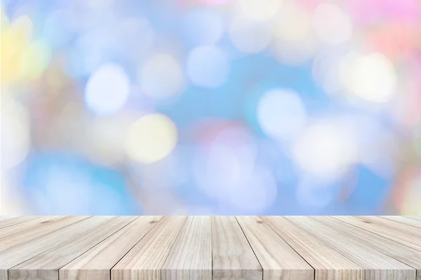 Empty top view of wooden table or counter on colorful bokeh back