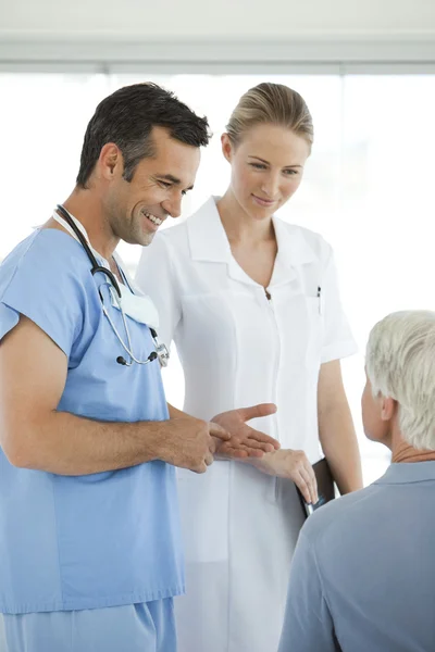 Doctor and nurse visiting a senior patient