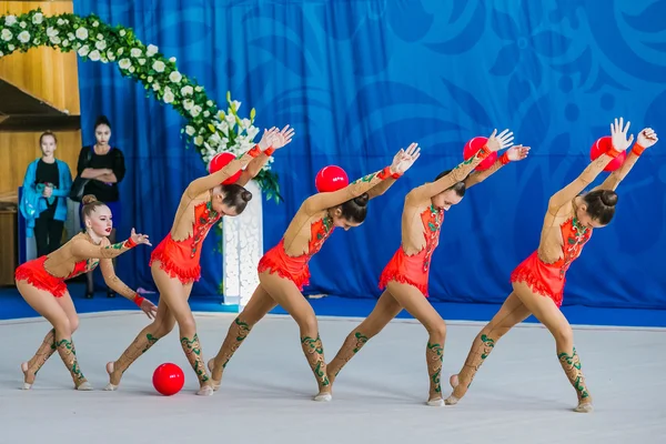 Group performance gymnasts exercises with ball