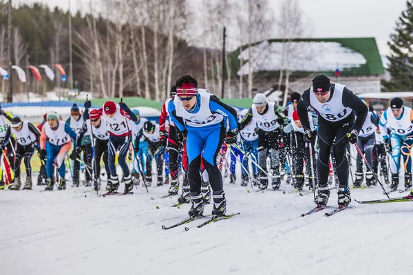 Mass start of skiers athletes marathon distance