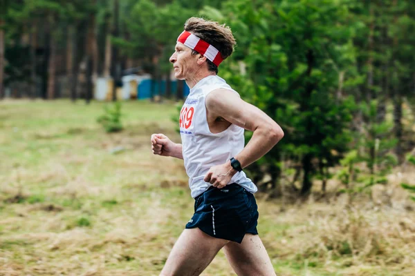 Single man middle-aged runner in Park