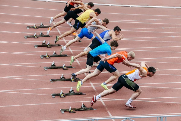 Start men athletes at sprint distance of 100 meters