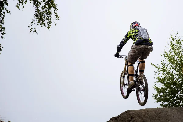 Male athlete extreme jump on a bike