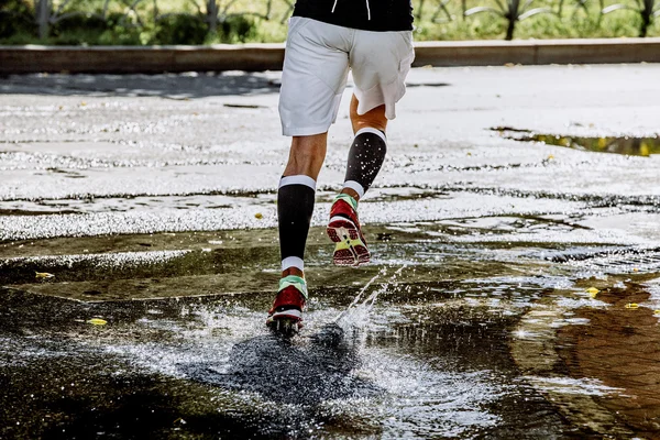 Male athlete running in compression socks