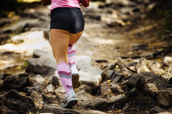 View of back woman marathon runner