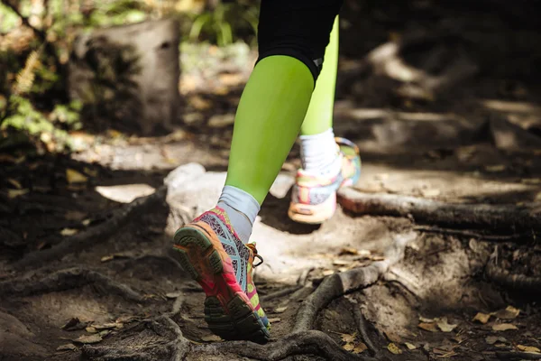 Woman runs marathon in woods trail
