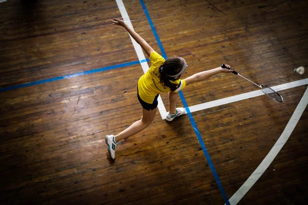 Badminton courts with player competing