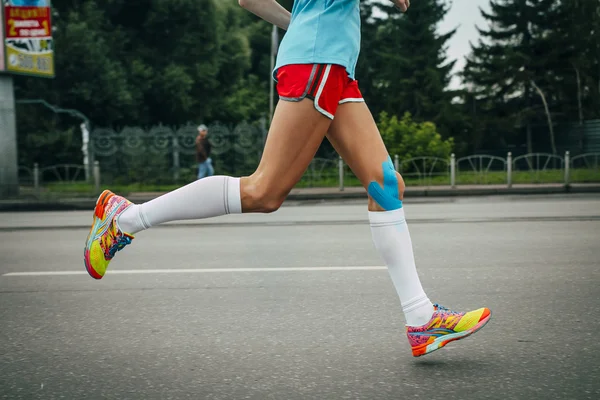 Girl athlete running a marathon