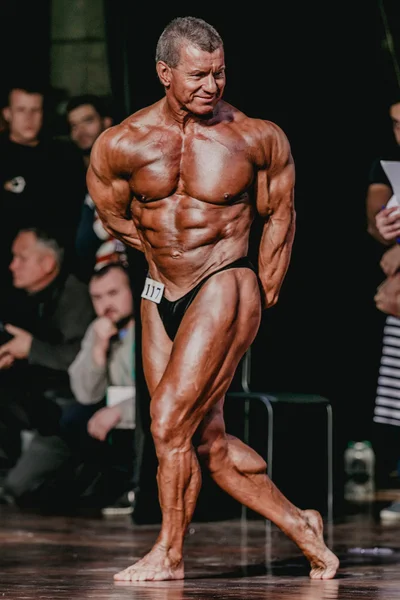 Athlete bodybuilder in middle age in full growth