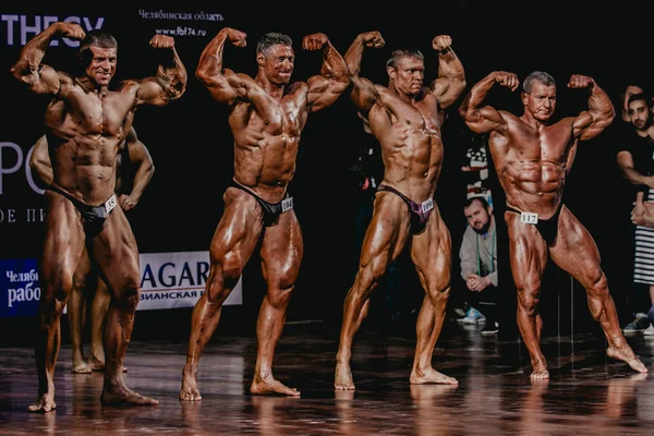 Group of men bodybuilder full length