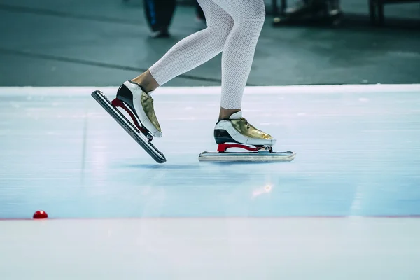 Closeup feet girl speed skaters