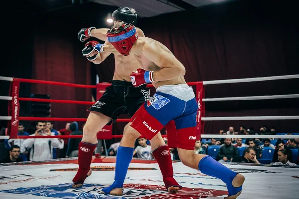 Athlete mixed martial arts deals cross hand on head of opponent