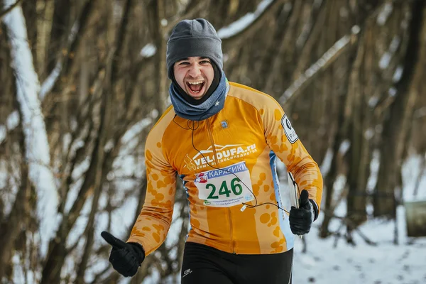 Cheerful young man runner