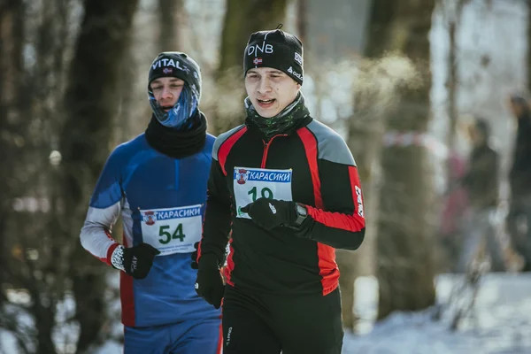 Two young men athletes run