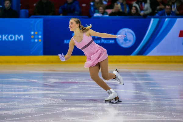 Young girl athlete figure skater performance on ice