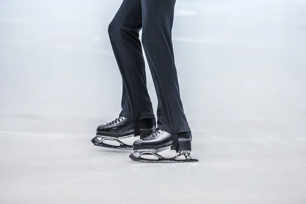 Feet of a young athlete figure skater
