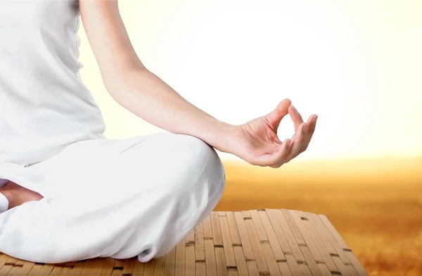 Calm woman doing yoga exercise