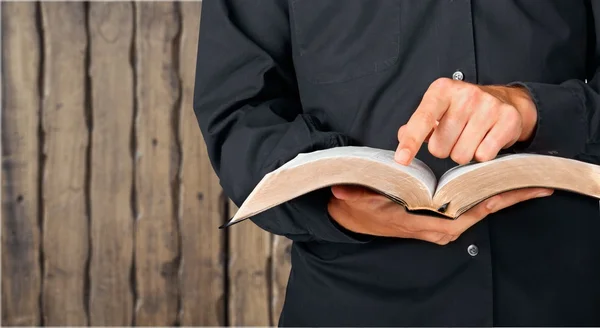 Man reading old heavy book