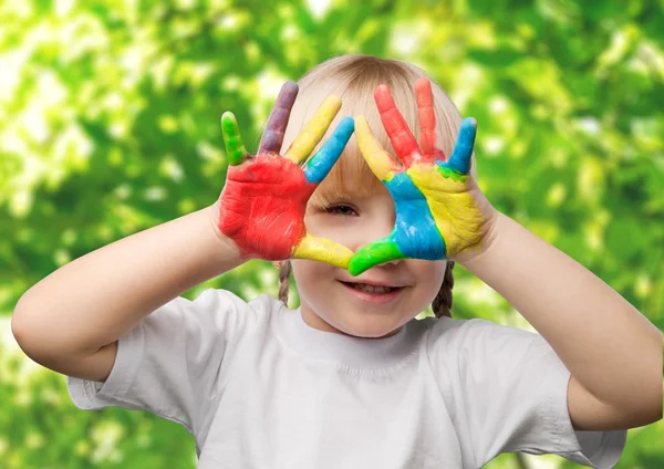 Cute little girl with colorful hands