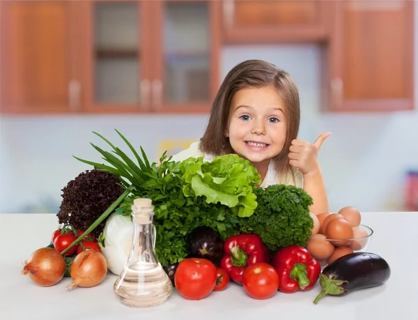 girl  in   cook hat with vegetables