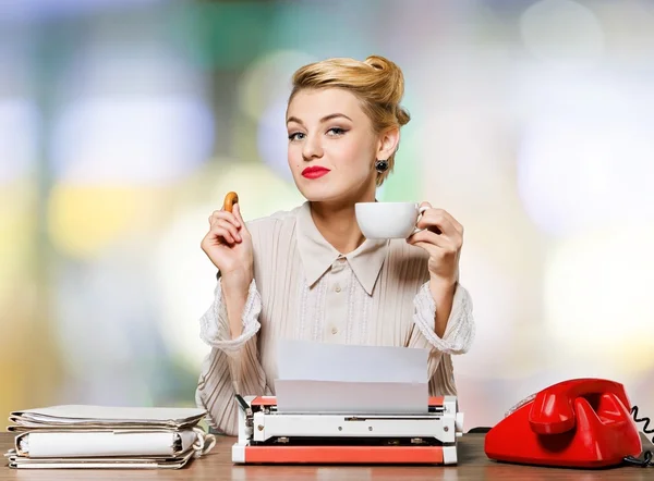 Woman working on vintage typewriter