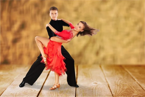 Man and a woman dancing Salsa