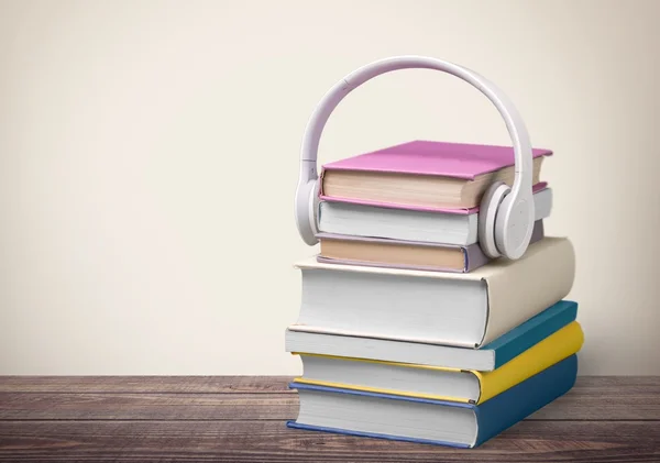 Headphones, Book, Audio Equipment.