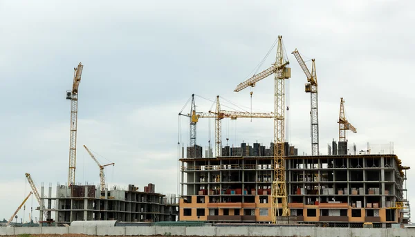 Construction of houses, construction cranes, construction materi