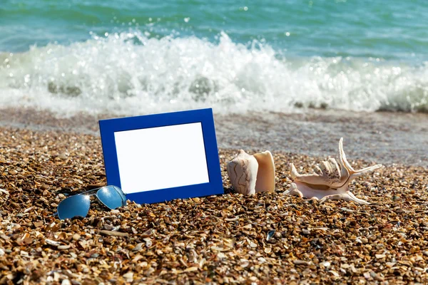 Photo frame on the beach, photography on the beach, sea shells,