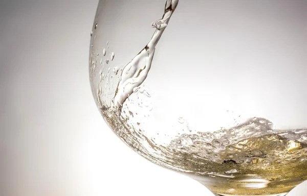 Stream of wine being pouring into a glass closeup, wine, splashing, splash, bubbles, fizz