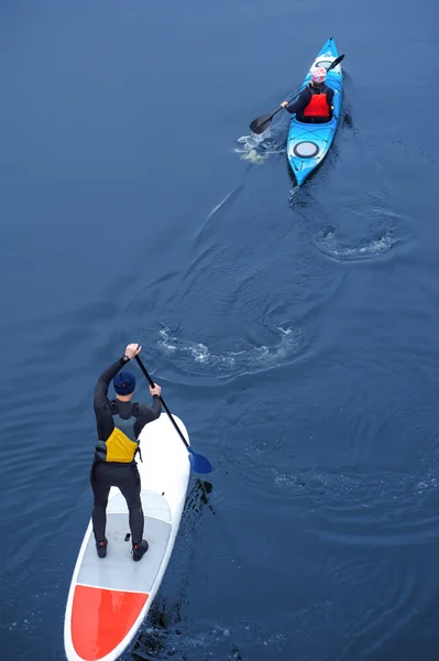 SUP group of athletes kayaking on the river03