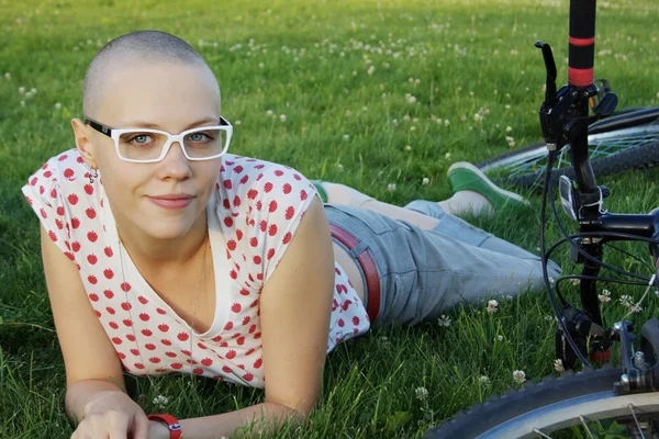 Bald girl with glasses