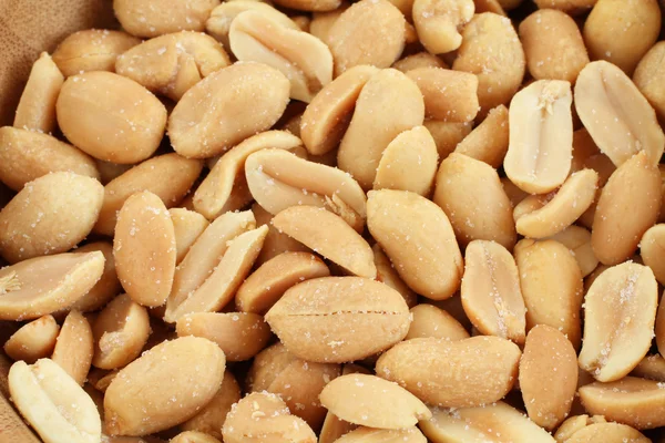 Salted roasted peanuts in bamboo bowl