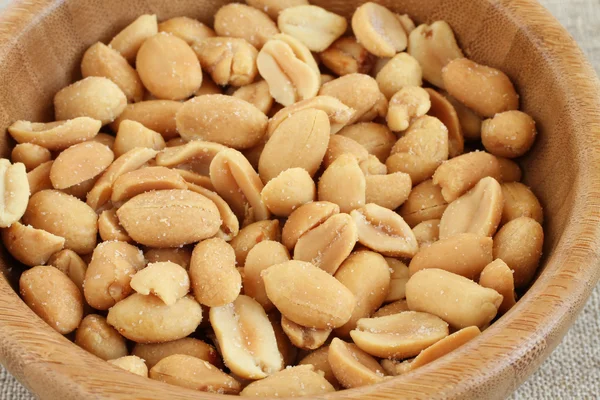 Salted roasted peanuts in bamboo bowl