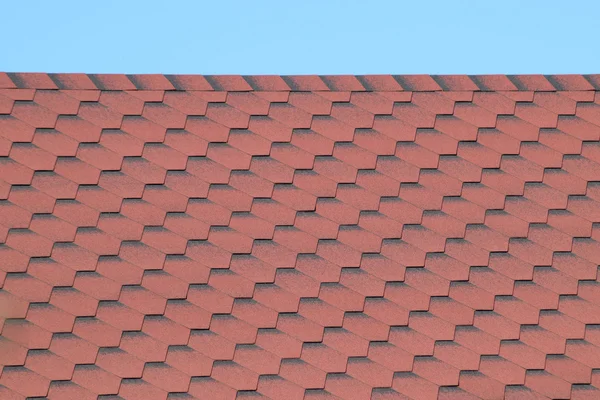 Decorative metal tile on a roof