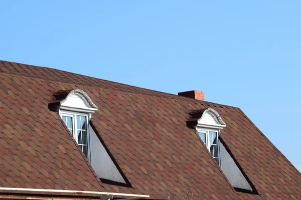 House with a roof made of metal sheets