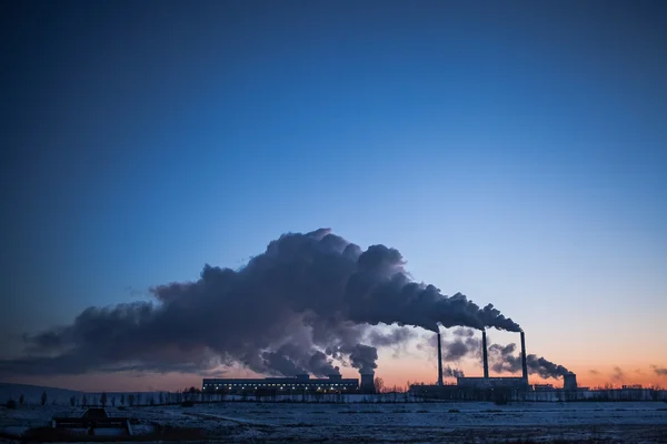 Central Heating and Power Plant with smoke at winter day