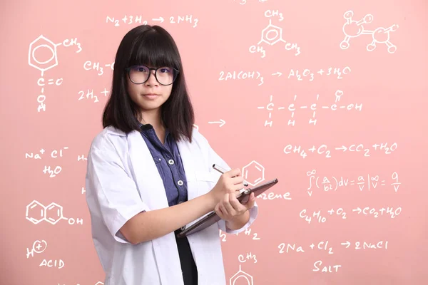 Asian scientist taking note on tablet