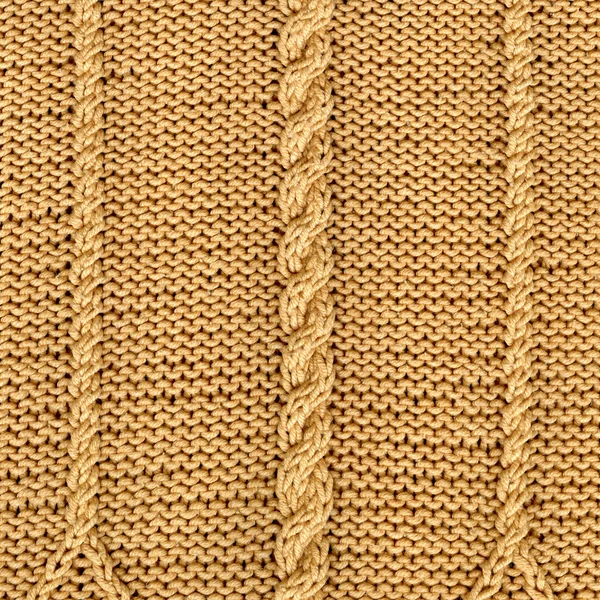 Beige knitted natural wool texture background. Knitted pattern